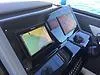 Slide: The Image of 2021 Cruisers Yachts 42 GLS OB dashboard with navigation screens and controls. - 23