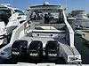 Slide: The Image of 2021 Cruisers Yachts 42 GLS OB with triple outboard engines at a marina. - 27