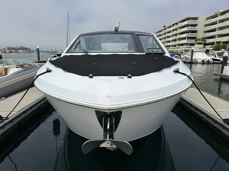 Slide: The Image of 2021 Cruisers Yachts 42 GLS OB docked in marina, front view. - 47