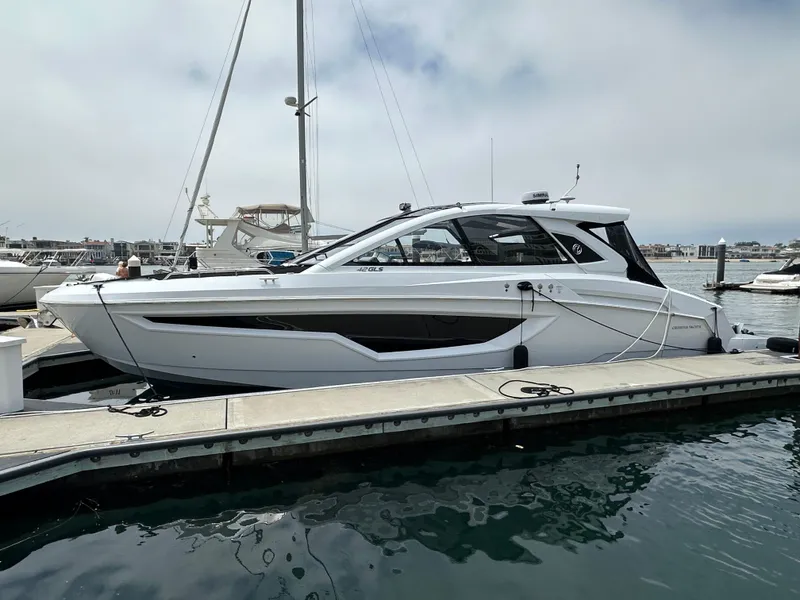 Slide: The Image of 2021 Cruisers Yachts 42 GLS OB docked at marina, side view. - 49