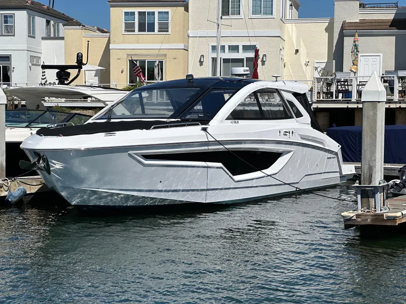 Slide: The Image of 2021 Cruisers Yachts 42 GLS OB docked near waterfront homes. - 61