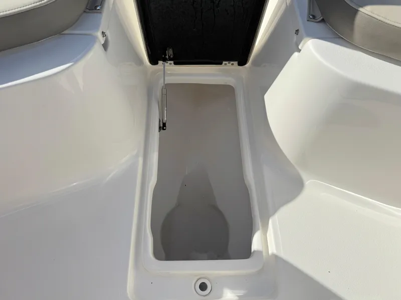Slide: The Image of 2023 Key West 239 FS boat storage compartment, open and empty. - 14