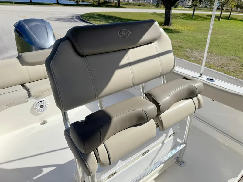 Slide: The Image of 2023 Key West 239 FS boat seating with cushioned backrest and armrests. - 19