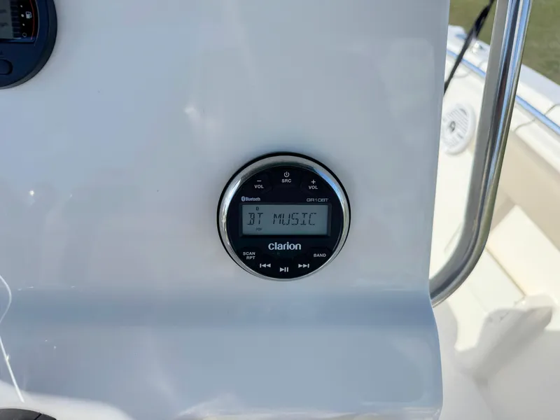 Slide: The Image of Clarion audio system on 2023 Key West 239 FS boat dashboard. - 23