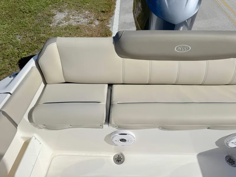 Slide: The Image of 2023 Key West 239 FS boat with beige seating and speaker detail. - 27