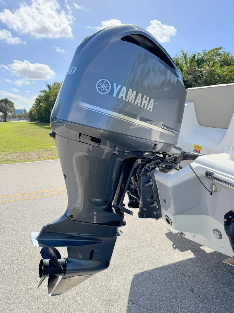 Slide: The Image of 2023 Key West 239 FS boat with Yamaha outboard motor in sunny outdoor setting. - 34