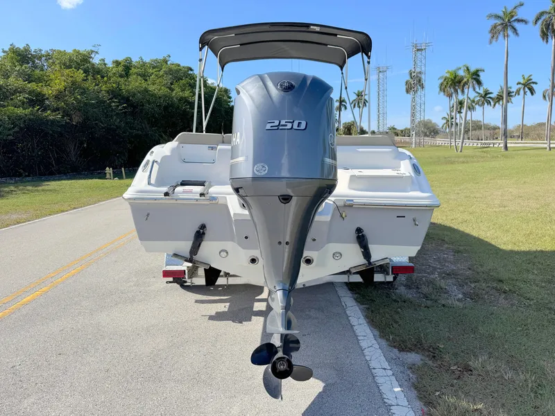 Slide: The Image of 2023 Key West 239 FS boat with 250 horsepower engine on trailer. - 4