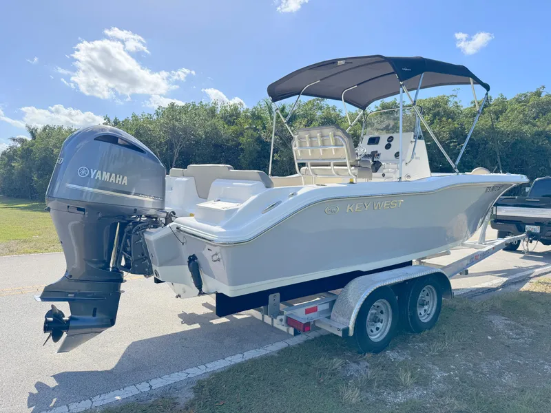 Slide: The Image of 2023 Key West 239 FS boat on trailer with Yamaha outboard motor. - 5