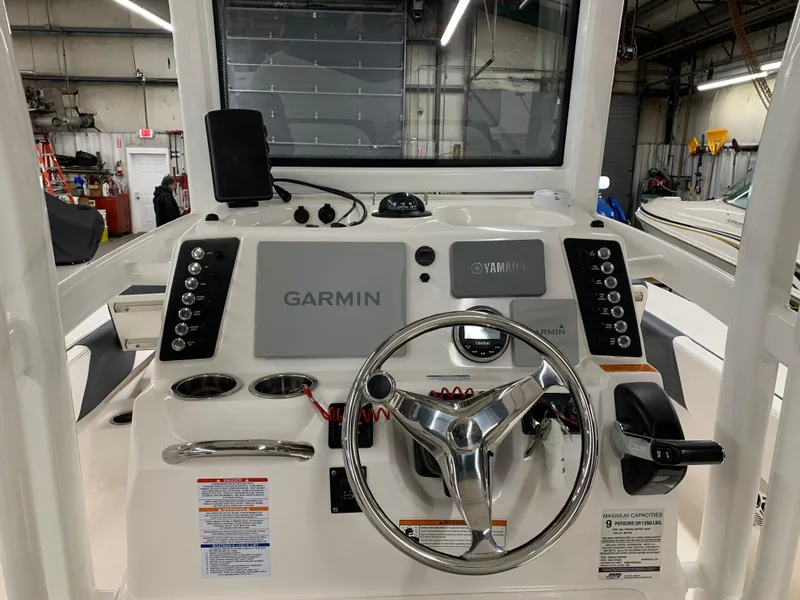 Slide: The Image of 2019 Robalo 246 Cayman boat dashboard with Garmin navigation system. - 13
