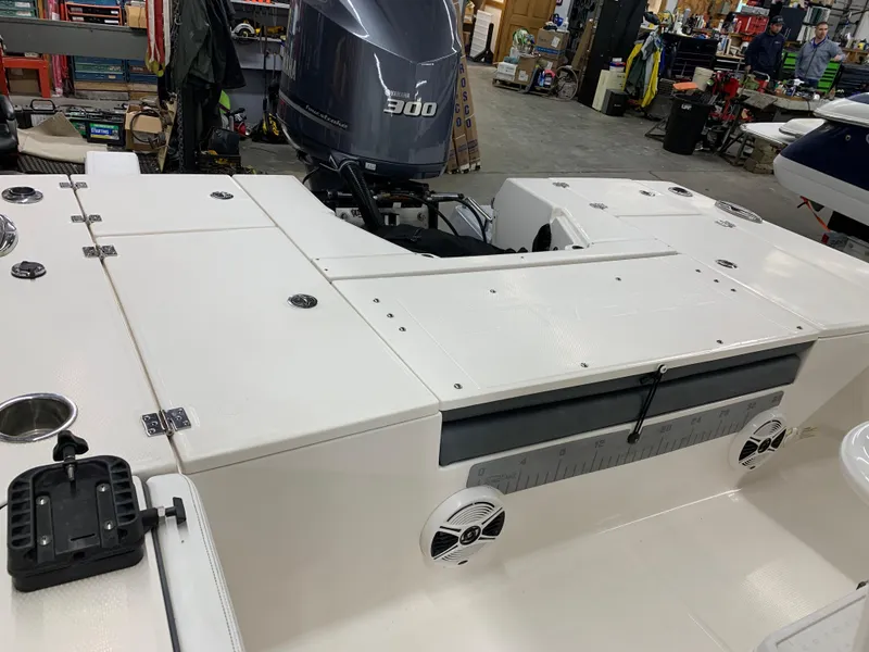 Slide: The Image of 2019 Robalo 246 Cayman boat with Yamaha 300 engine in a workshop setting. - 15