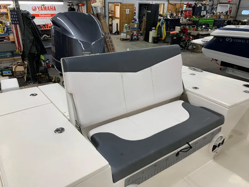 Slide: The Image of 2019 Robalo 246 Cayman boat seat in a workshop setting. - 16