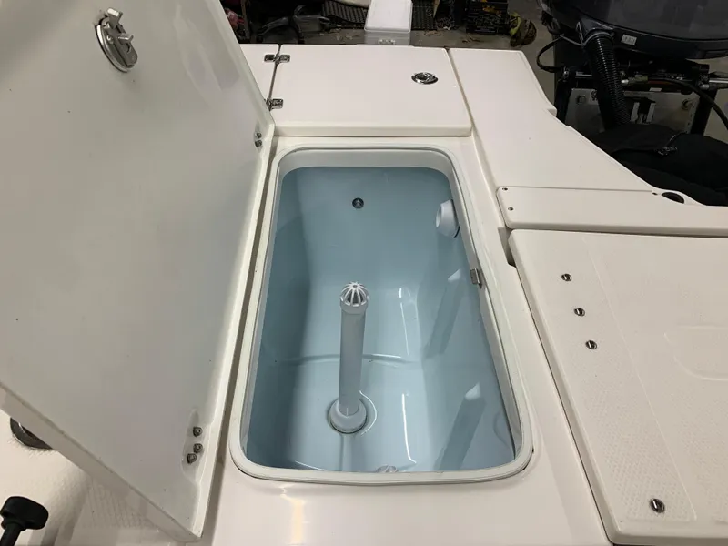 Slide: The Image of Open storage compartment on 2019 Robalo 246 Cayman boat. - 18