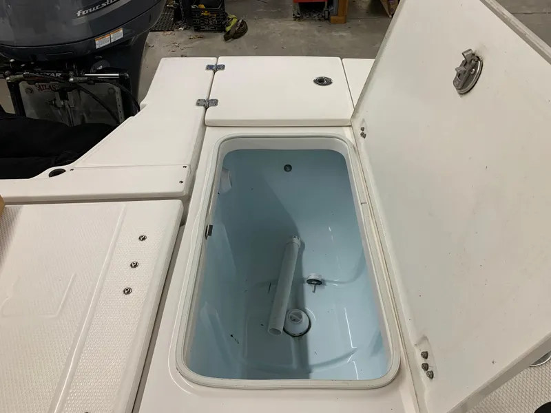 Slide: The Image of Open storage compartment on 2019 Robalo 246 Cayman boat. - 19
