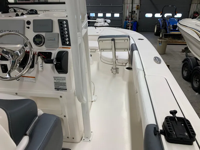Slide: The Image of 2019 Robalo 246 Cayman boat interior with steering console and seating. - 20