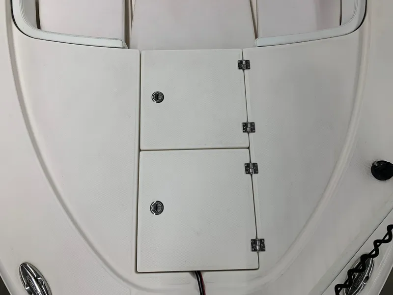 Slide: The Image of 2019 Robalo 246 Cayman boat deck with storage compartments. - 32