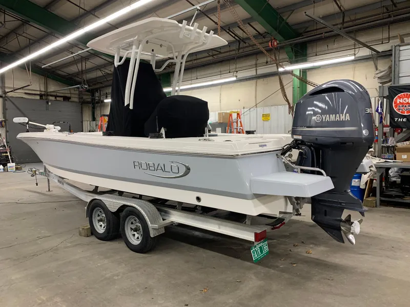 Slide: The Image of 2019 Robalo 246 Cayman boat with Yamaha engine on trailer in warehouse. - 6