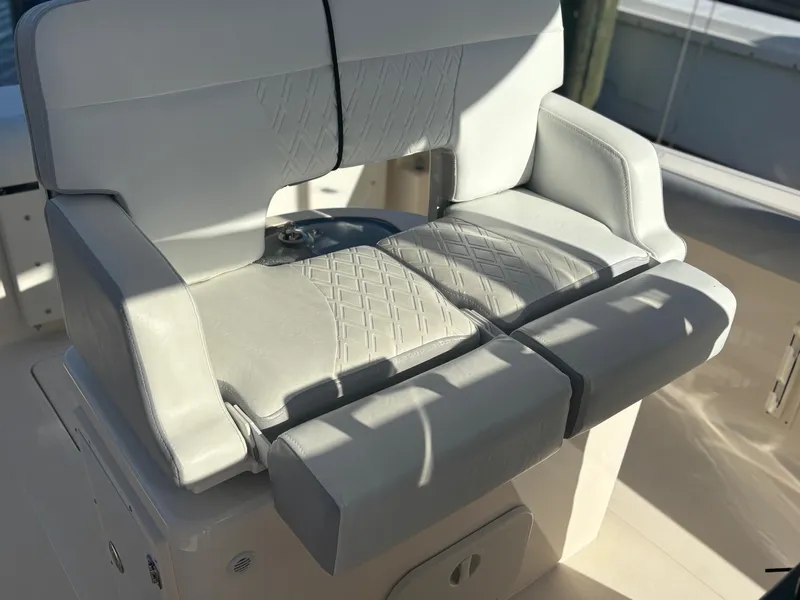 Slide: The Image of 2014 Pursuit C 260 Center Console boat seat with cushioned upholstery. - 20