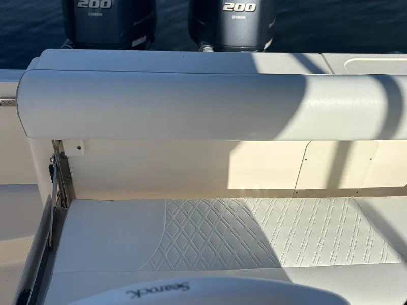 Slide: The Image of 2014 Pursuit C 260 Center Console boat interior with twin 200 engines. - 23