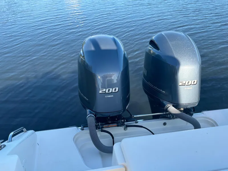 Slide: The Image of Twin 200 horsepower engines on a 2014 Pursuit C 260 Center Console boat. - 27