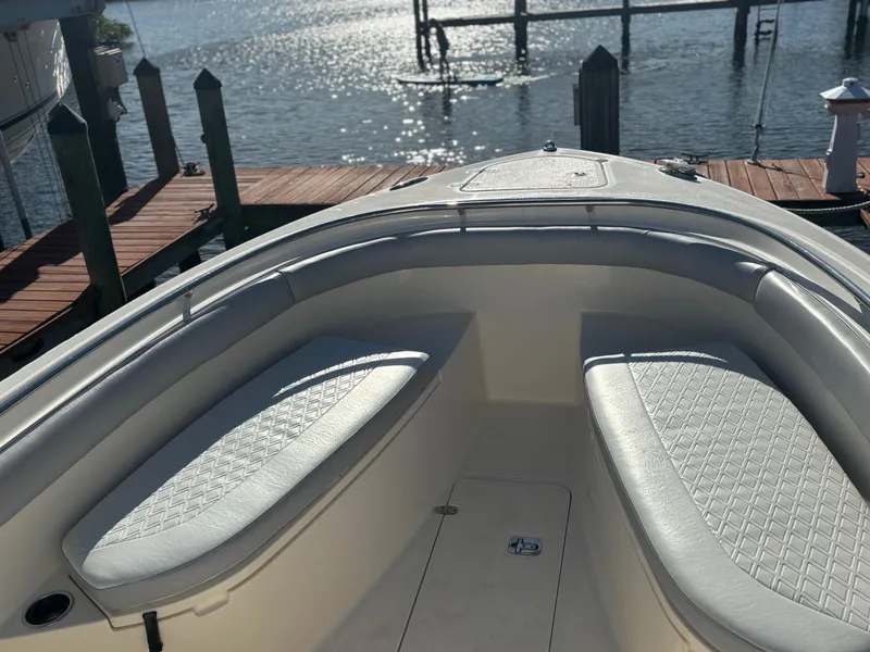 Slide: The Image of 2014 Pursuit C 260 Center Console boat interior with waterfront view. - 5