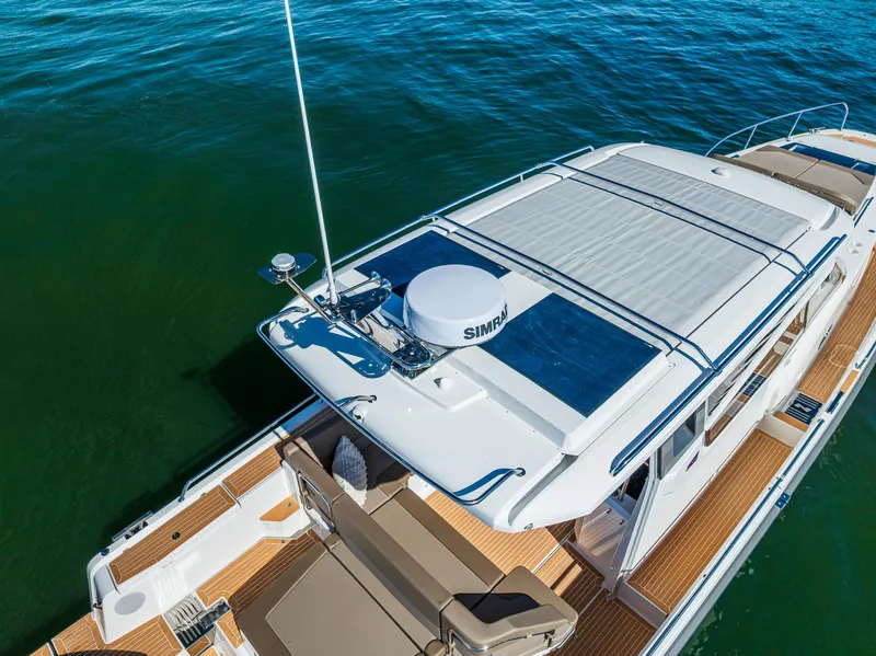 Slide: The Image of Nimbus W11 2025 yacht with sleek design, spacious deck, and modern amenities on calm water. - 10