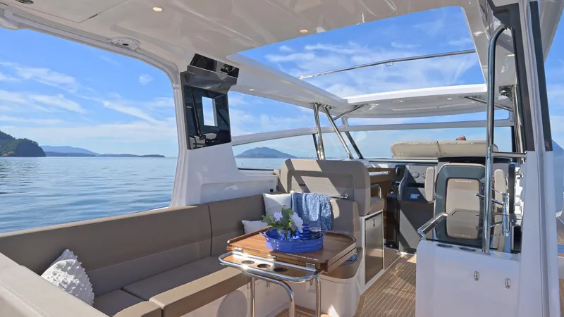 Slide: The Image of Luxurious 2025 Nimbus W11 yacht interior with elegant seating and scenic ocean view. - 13
