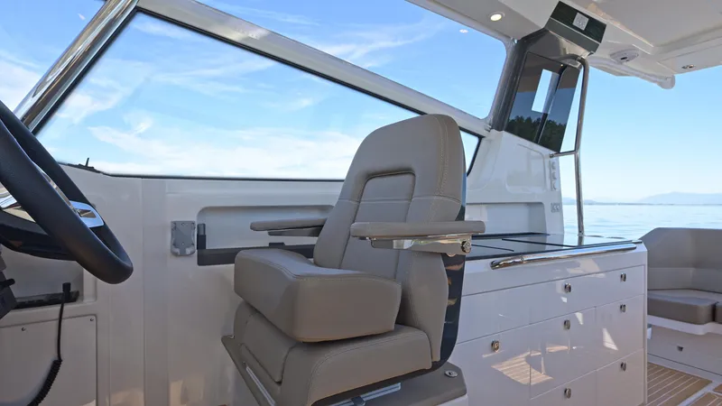 Slide: The Image of Captain's seat and helm of Nimbus W11 boat, 2025 model, with ocean view. - 18