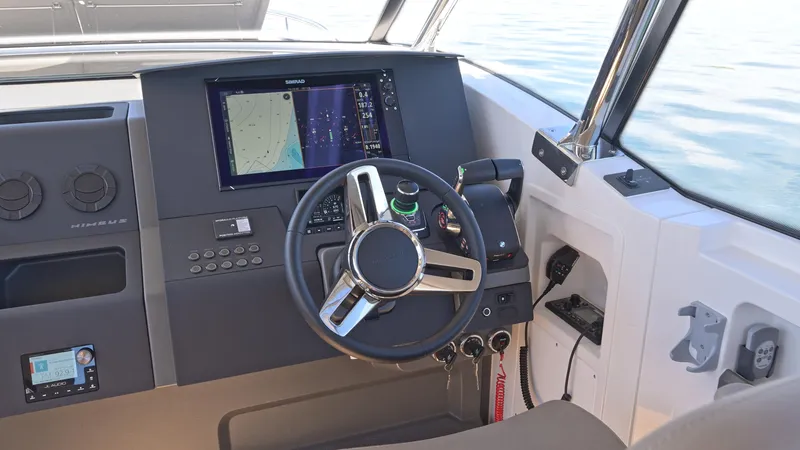 Slide: The Image of Helm of 2025 Nimbus W11 boat with navigation system and steering wheel. - 19