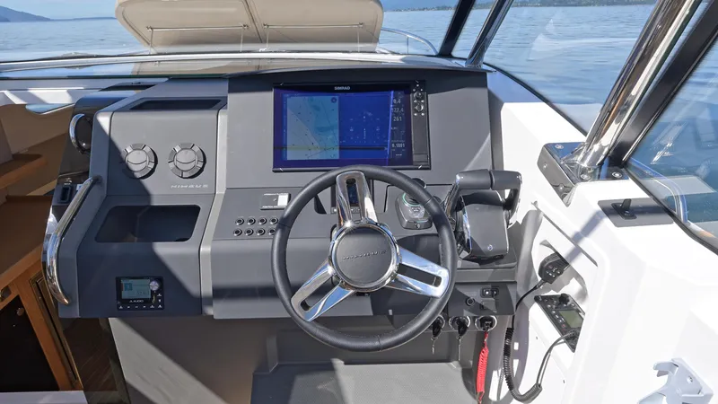 Slide: The Image of Helm of 2025 Nimbus W11 boat with modern controls and navigation display. - 20