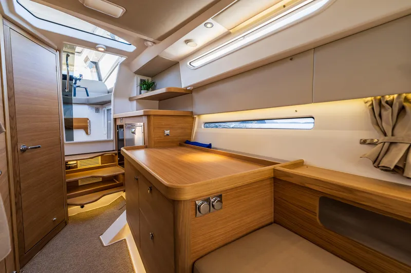 Slide: The Image of Luxurious interior of 2025 Nimbus W11 yacht with wooden finishes and modern design. - 23