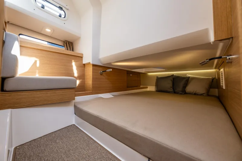Slide: The Image of Luxurious interior of 2025 Nimbus W11 yacht with cozy bed and modern lighting. - 30