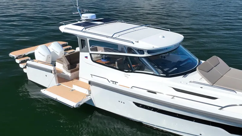 Slide: The Image of 2025 Nimbus W11 boat on water, featuring sleek design and modern amenities. - 7