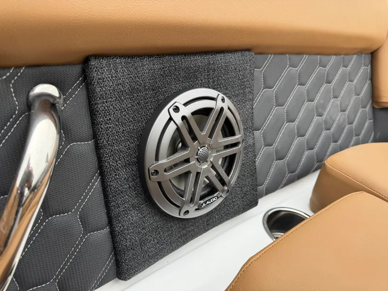 Slide: The Image of 2025 Four Winns H2 OB interior speaker with stylish upholstery and cup holder. - 18