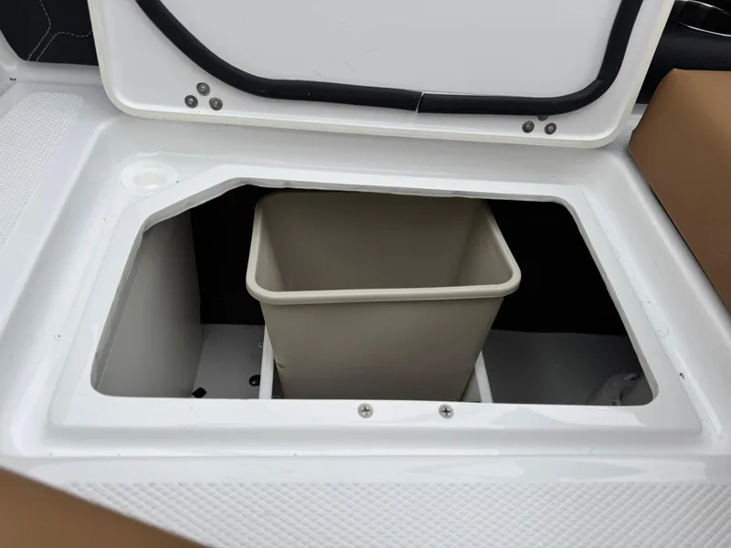 Slide: The Image of Storage compartment with bin in 2025 Four Winns H2 OB boat. - 22