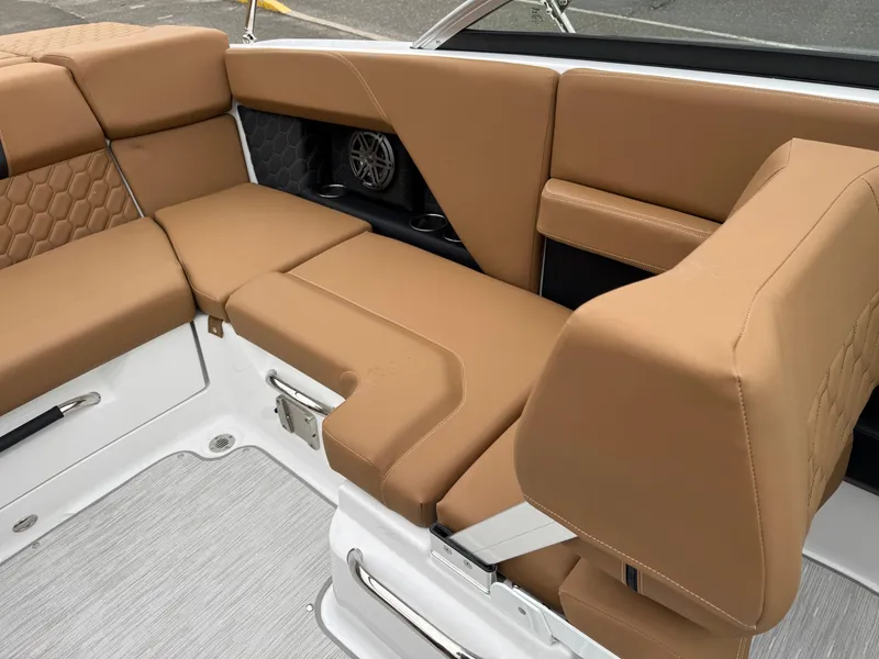 Slide: The Image of Luxurious tan seating in 2025 Four Winns H2 OB boat interior. - 24