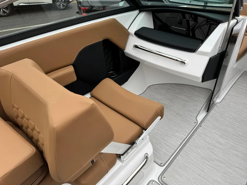 Slide: The Image of 2025 Four Winns H2 OB boat interior with tan seating and modern design. - 5