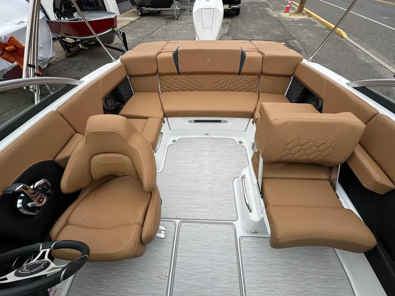 Slide: The Image of 2025 Four Winns H2 OB boat interior with tan leather seating and modern design. - 8