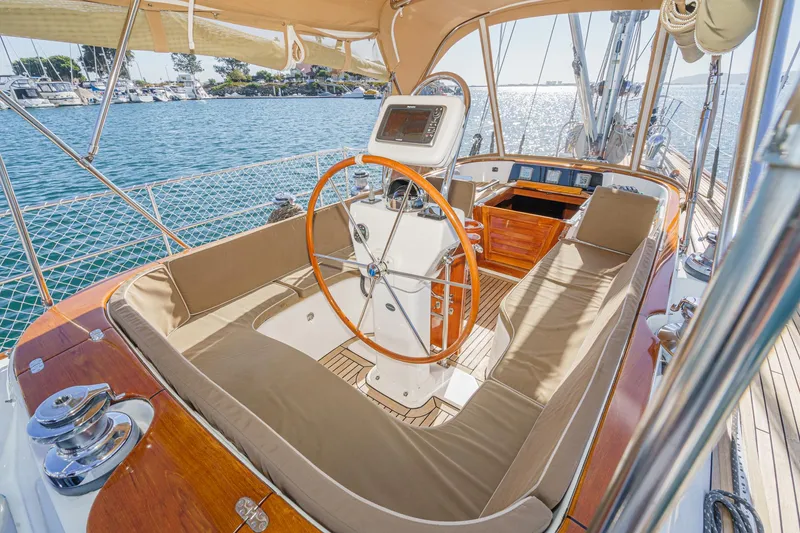 Slide: The Image of Luxurious 2012 Hylas 46 yacht cockpit with wooden accents and ocean view. - 1