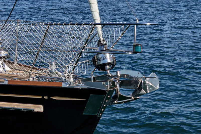 Slide: The Image of Hylas 46 sailboat bow with stainless steel fittings, 2012 model, on calm blue water. - 12