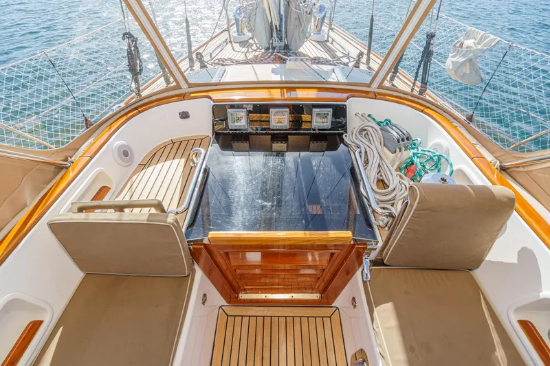 Slide: The Image of Luxurious 2012 Hylas 46 yacht cockpit with teak seating and navigation equipment. - 19