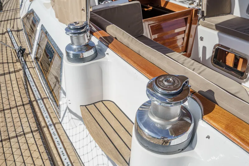 Slide: The Image of Hylas 46 sailboat deck with winches and teak accents, 2012 model. - 21