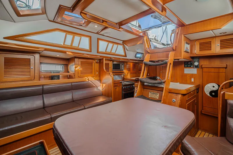 Slide: The Image of Luxurious 2012 Hylas 46 yacht interior with wood finish and leather seating. - 23
