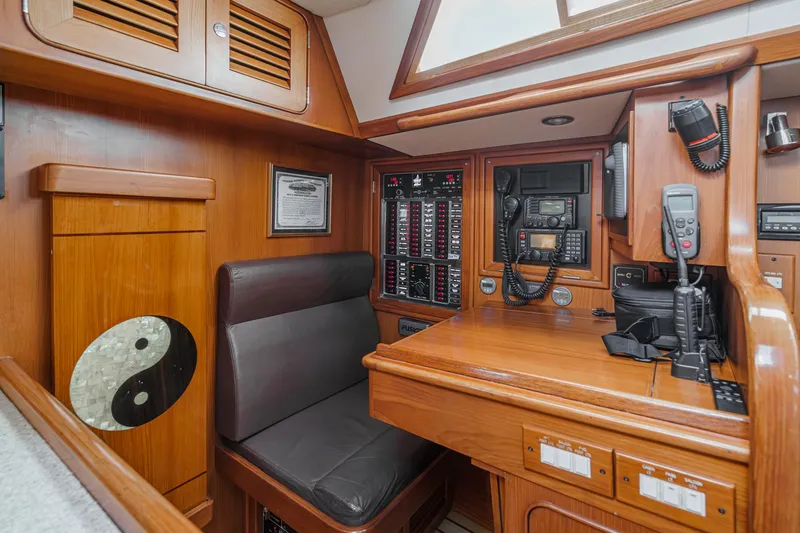 Slide: The Image of Interior of 2012 Hylas 46 yacht with navigation station and communication equipment. - 24