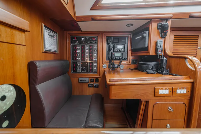 Slide: The Image of Hylas 46 yacht interior, 2012 model, featuring navigation station and control panels. - 25