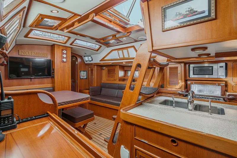 Slide: The Image of Luxurious 2012 Hylas 46 yacht interior with wood finish, skylights, and modern amenities. - 29