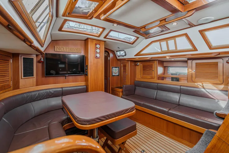 Slide: The Image of Luxurious interior of a 2012 Hylas 46 yacht with wood finishes and skylights. - 30