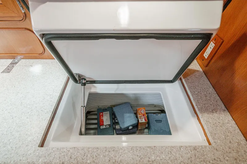 Slide: The Image of Open storage compartment on 2012 Hylas 46 yacht interior. - 39