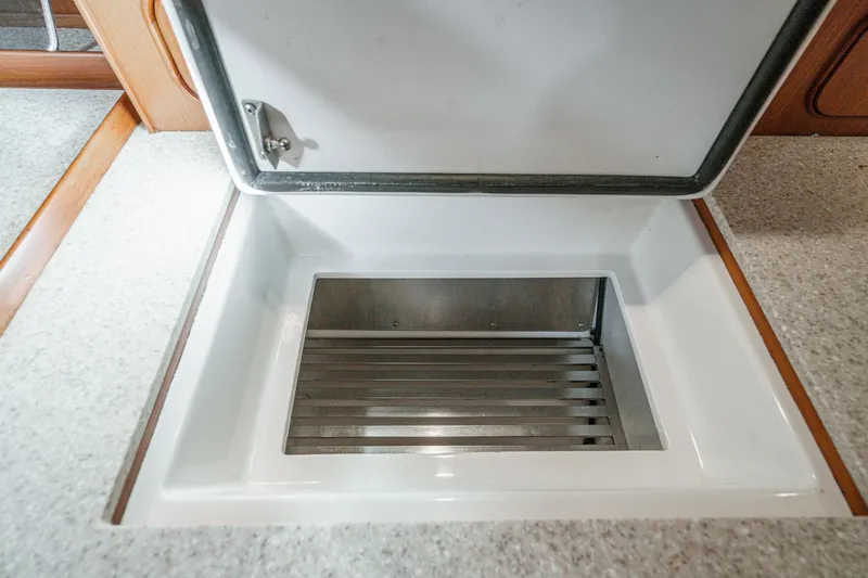 Slide: The Image of Open storage compartment in 2012 Hylas 46 yacht interior. - 40
