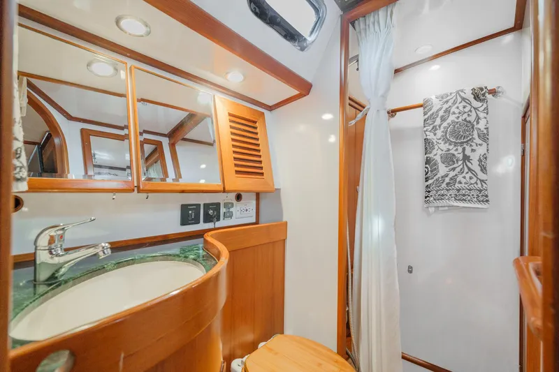 Slide: The Image of Luxurious 2012 Hylas 46 yacht bathroom with wood accents and modern fixtures. - 45