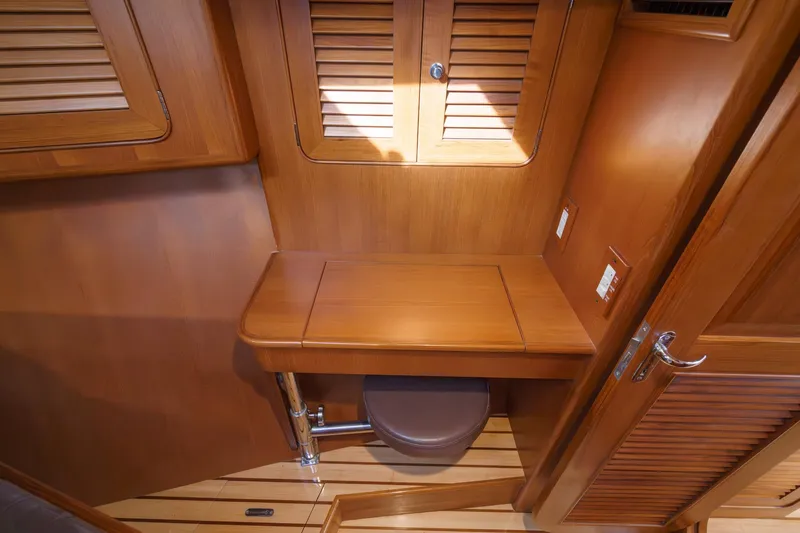 Slide: The Image of Wooden interior of 2012 Hylas 46 yacht with foldable desk and storage. - 48